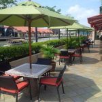 Commercial Projects black wicker chairs red cushions with parasols project bar  150x150