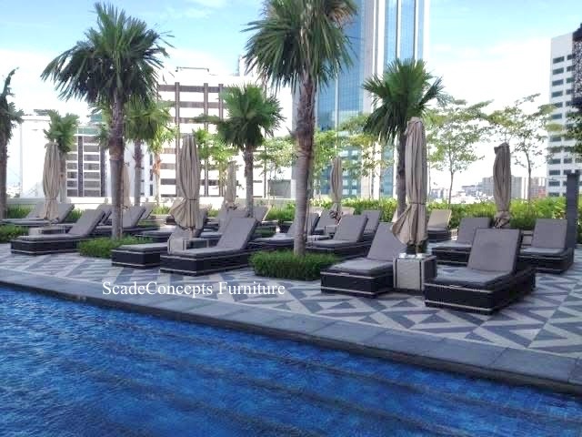 Commercial Projects wicker loungers cushions outdoor parasols poolside resort